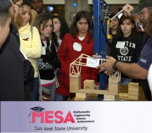 Students watch as judges test a bridge at MESA Day 2010.