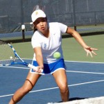 Spartan female tennis player on the court.