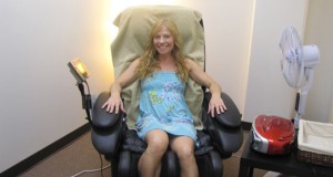 Female SJSU student sitting in the wellness massage chair. 