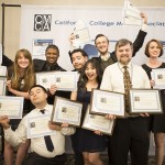 Spartan Daily student staff members hold up awards from the February California College Media Association's Award Banquet, with Professor Richard Craig, second from the right.