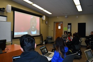 Students in Laura Guardino's U.S. History and Government (HIST 15A) course watch a short video in a 'smart classroom' in Sweeney Hall.