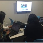 Students use a library study space with new furniture and video screens that support collaboration.