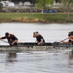 A team of SJSU students compete in a men's sprint race with their concrete canoe.