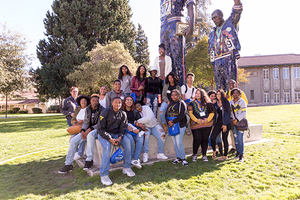 Photo: David Schmitz Students visit the Smith and Carlos sculpture during a campus tour.
