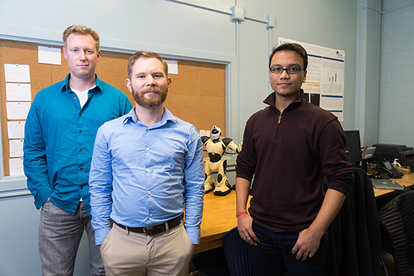 Left to right, Ian Cooke, Dr. Dave Schuster and Soham Shah pose for a photograph at San Jose State University, on Thursday, Feb. 2, 2017. Dr. Schuster has received a grant for cybersecurity research. (Photo: James Tensuan, '15 Journalism)
