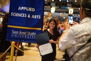 Photo: James Tensuan Kinalani Hoe poses with her certificate at the 2017 Honors Convocation, where more than 4,300 students were recognized for achieving GPAs of 3.65 or higher.