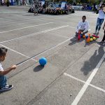 SJSU students lead children in a game of bowling. (Photo: James Tensuan, '15 Journalism)