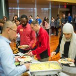 Guests help themselves to a buffet breakfast during the event. (Photo: James Tensuan, '15 Journalism)