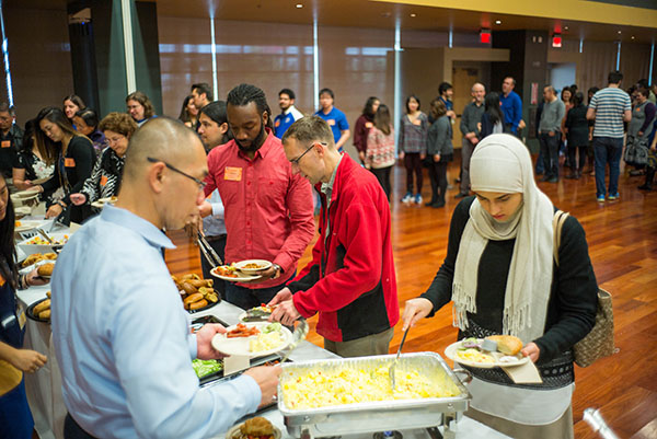 Guests help themselves to a buffet breakfast during the event. (Photo: James Tensuan, '15 Journalism)
