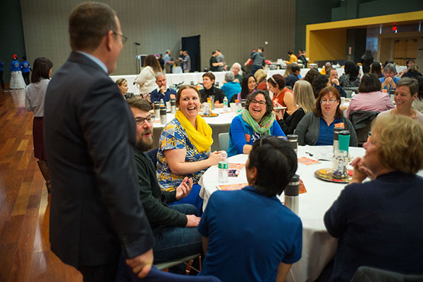 Provost Andy Feinstein laughs with staff members during the breakfast. (Photo: James Tensuan, '15 Journalism)