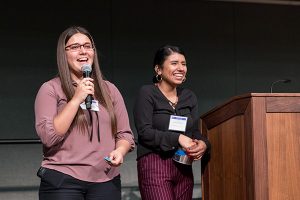 Photo: David Schmitz Janely Cerda, left, and Paola Quintanilla, welcomed students back to campus at the Chicanx/Latinx Student Success Center Welcome in January. They are both interns with the center.