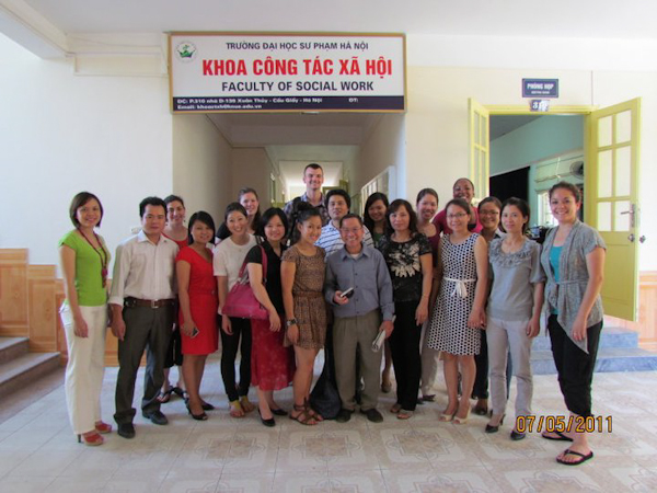 SJSU Students pose with the Faculty of Social Work in Hanoi, Vietnam. Photo by: Iliam Parra