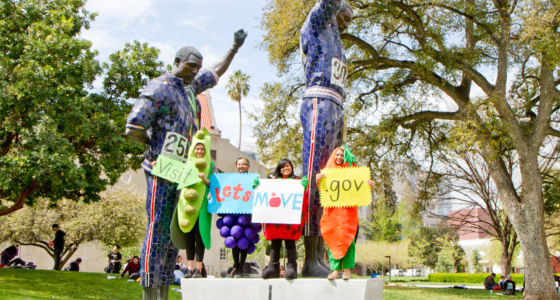 Four students in veggie costumes
