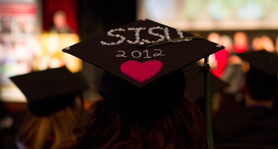 A close-up of a black graduation cap with the words "SJSU 2012" and a magenta heart. (Dillon Adams photo).