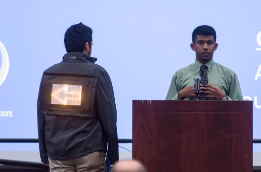 A student demonstrates Night Square during the Elevator Pitch Competition (Robert C. Bain photo).