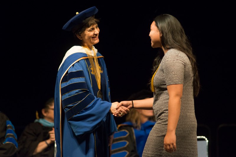 President Mary A. Papazian congratulates students at Honors Convocation on April 20 (photo by Brandon Chew, ’19 Photojournalism).