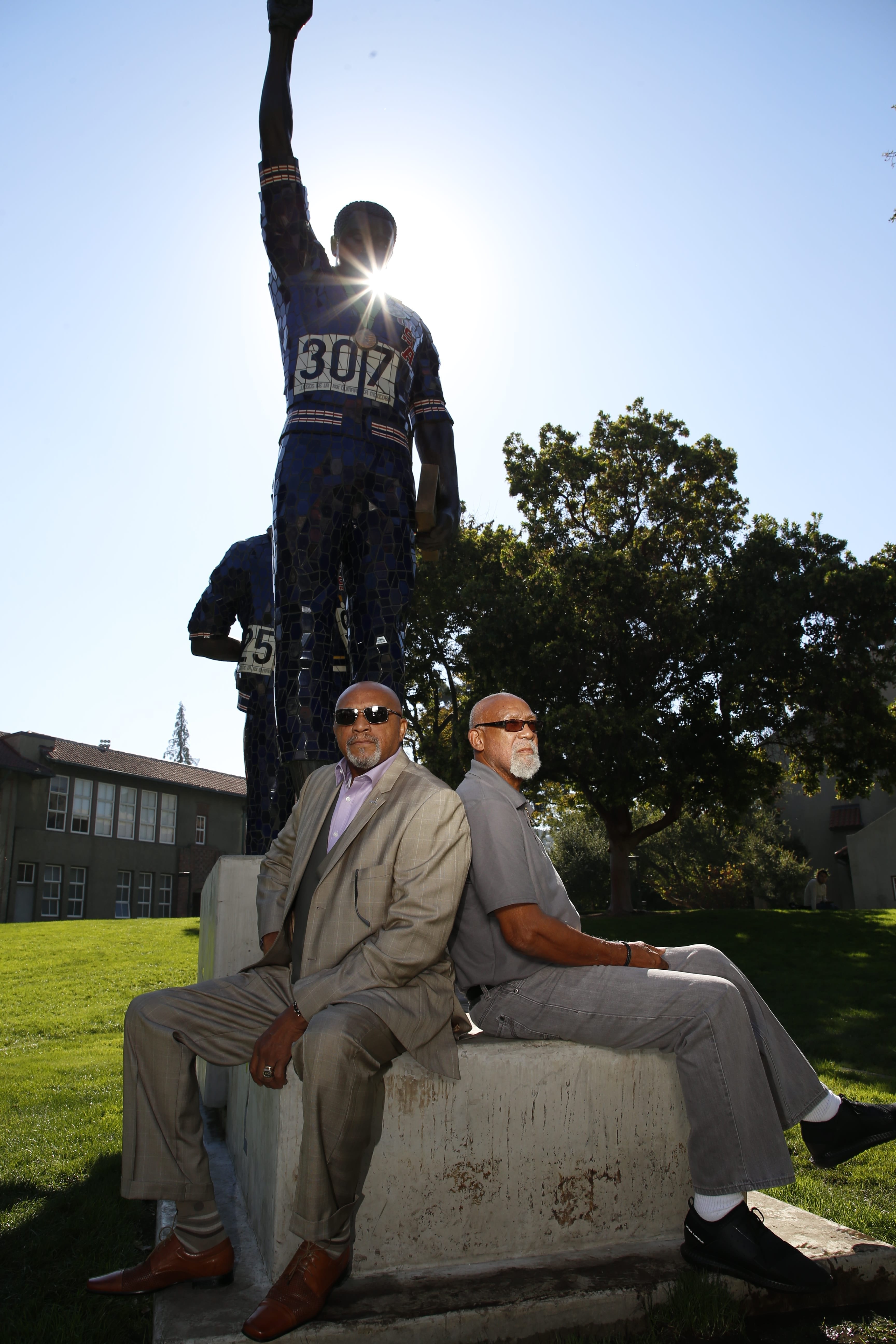 Photo: Josie Lepe Tommie Smith, '69 Social Science, '05 Honorary Doctorate, and John Carlos, '05 Honorary Doctorate, pose with the sculpture at San Jose State University that commemorates the courageous stand they took 50 years ago at the 1968 Olympics in Mexico City. 