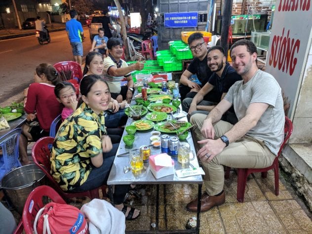 Prof Leineweber, far right, enjoys a meal in Nha Trang, Vietnam with SJSU student Hoang Nguyen and Nguyen's family.
