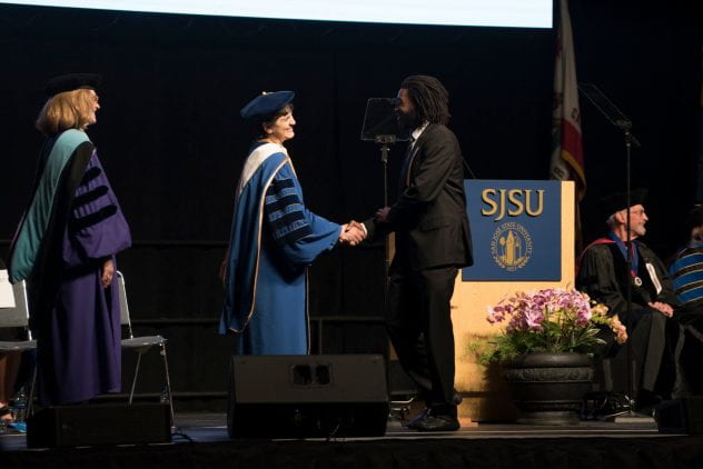 President Mary A. Papazian shakes hands with a President Scholar at Honors Convocation on May 3. Photo by Brandon Chew