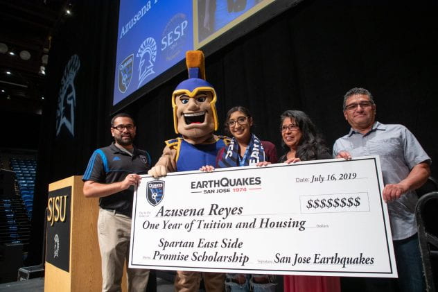 Azusena Reyes, photographed with her parents (on the right), is presented the East Side Promise Scholarship by San Jose Earthquakes representatives during freshman orientation at San Jose State University on Tuesday, July 16, 2019. (Photo: Jim Gensheimer)
