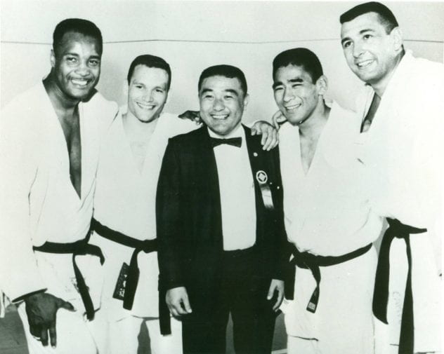 Yoshihiro Uchida, center, poses with members of the 1964 Olympic Judo Team.