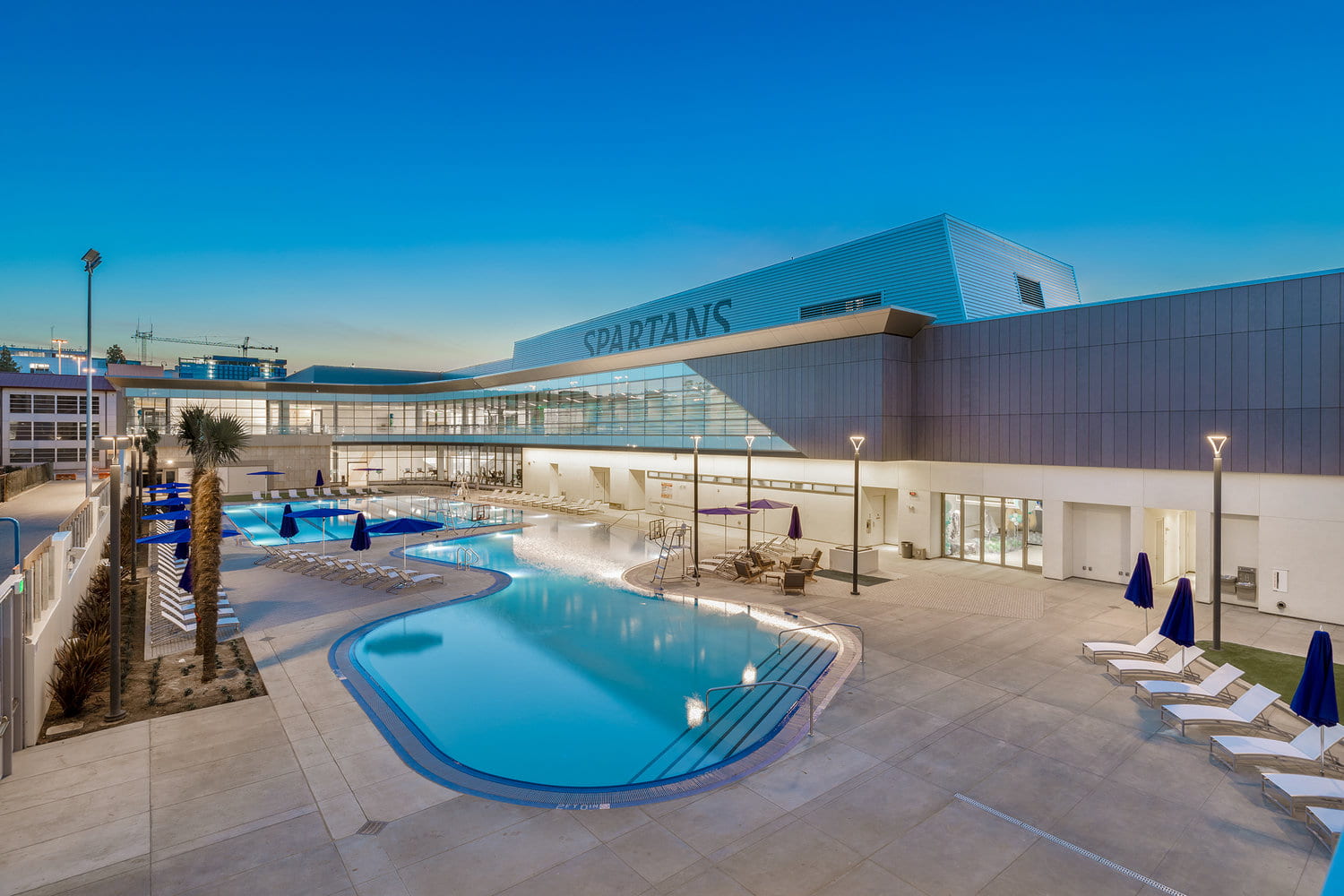 Night shot of the SRAC pool and exterior building.