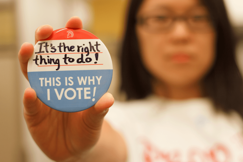SJSU student with voting button
