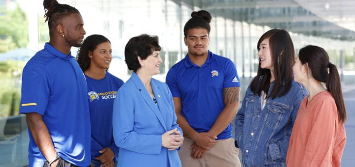 President Mary A. Papazian chatting with students.